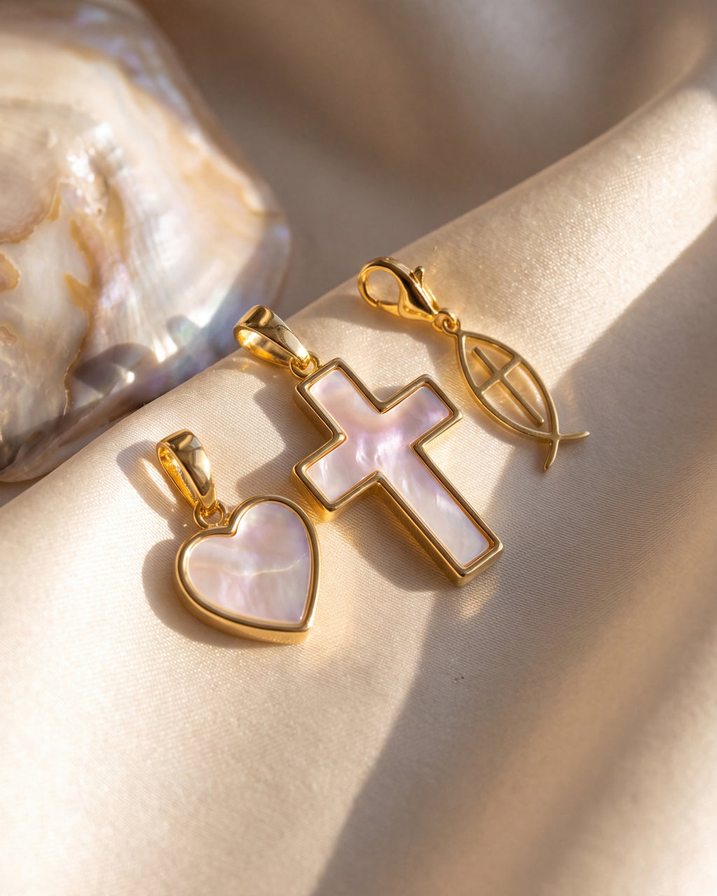 Mother-of-pearl heart and cross with the gold fish charm
