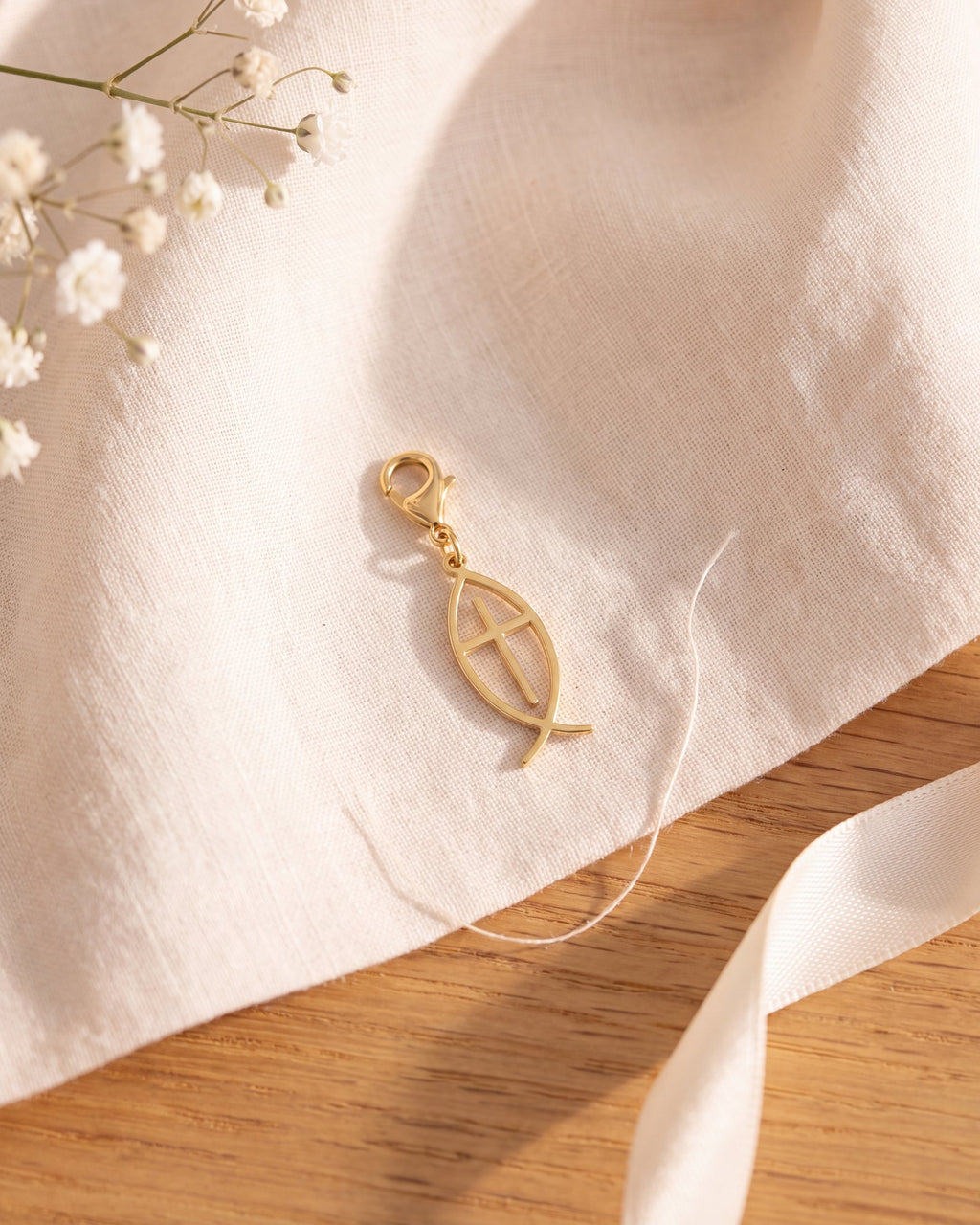 The gold fish charm on its own